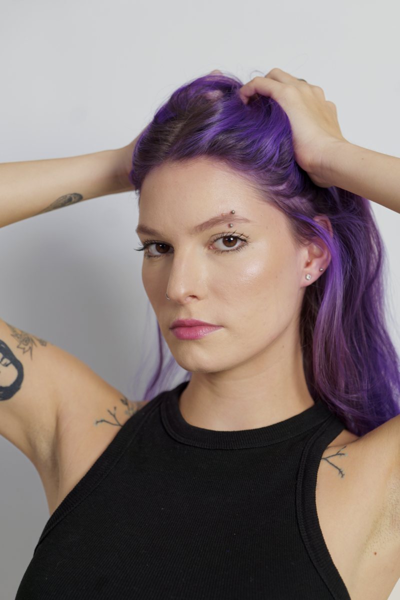Close-up portrait of Iulia with purple hair